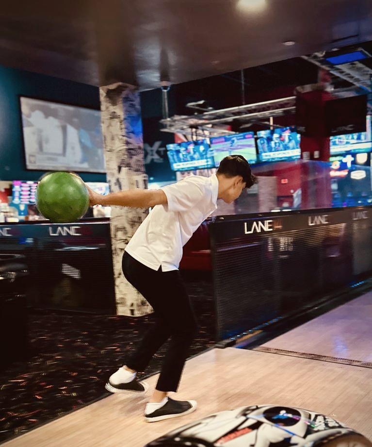 A talmid bowling on a yeshiva trip