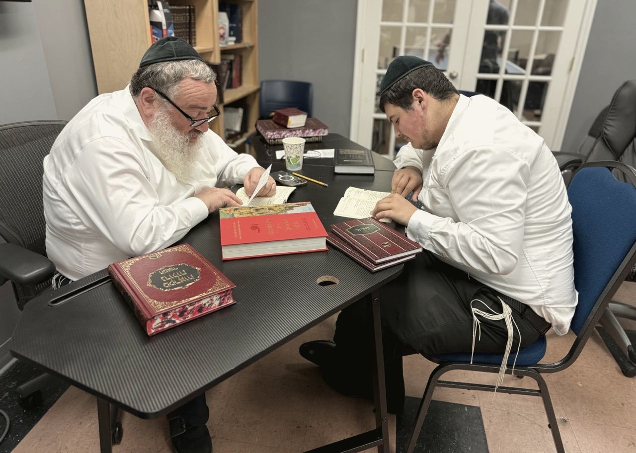A rebbe learning one on one with a talmid